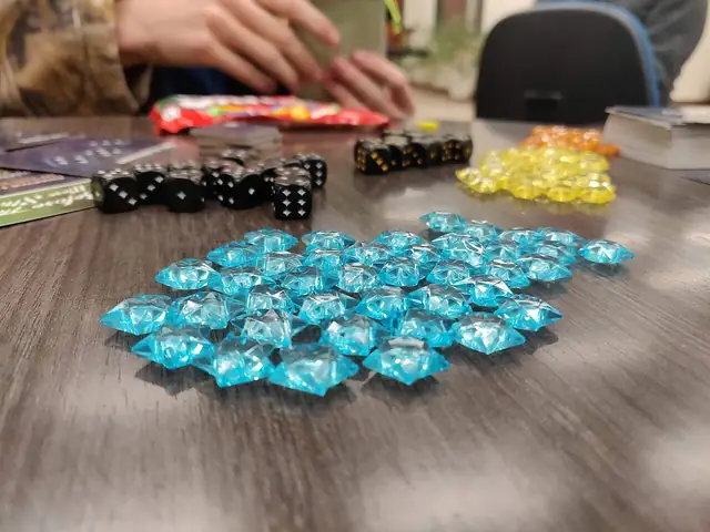 Colourful tokens and playing pieces arranged on a game table.