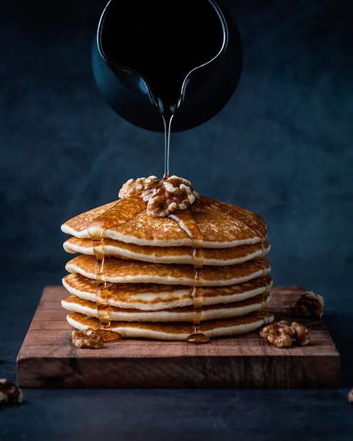 A stack of pancakes served for breakfast.