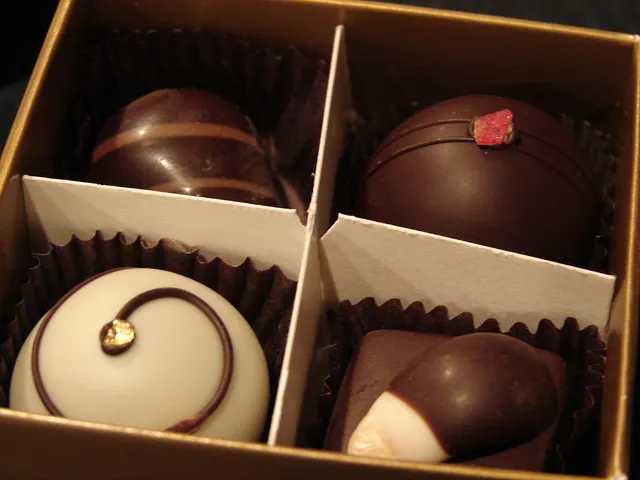 Small chocolate truffles ready to taste.