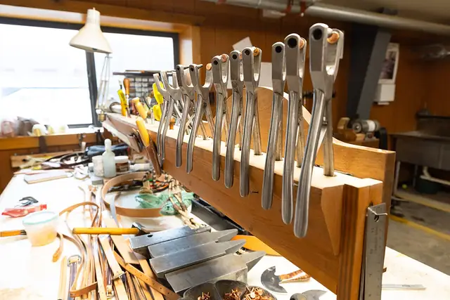 Tools and materials in a leatherworking workshop.