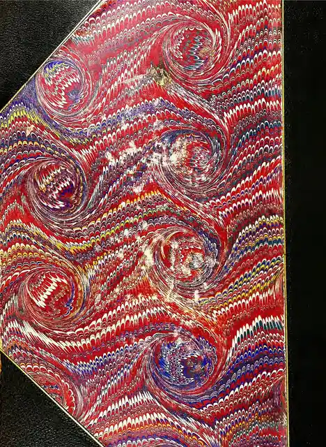A nineteenth-century example of red marbled paper.