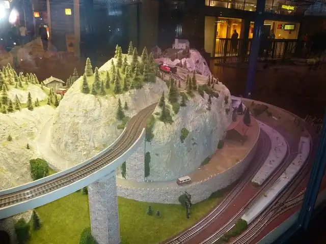 Tracks and scenery on a model railway layout.