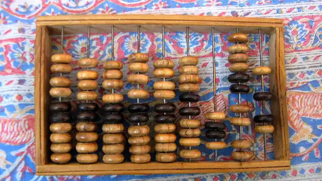 An abacus with rows of counting beads.