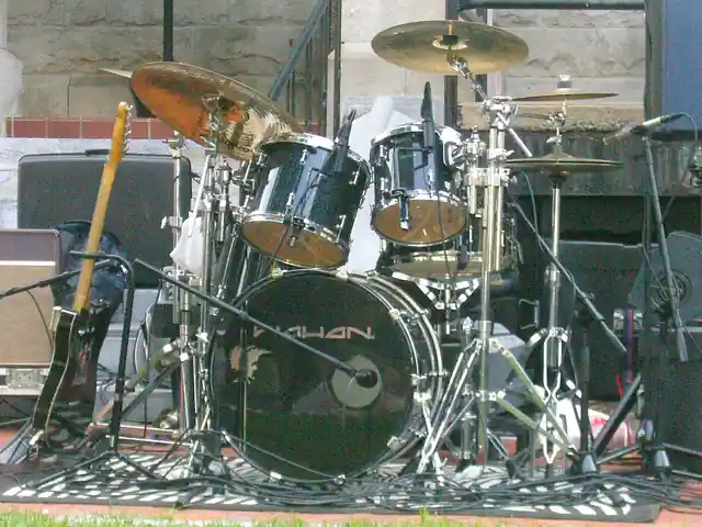 A drum kit arranged for playing.