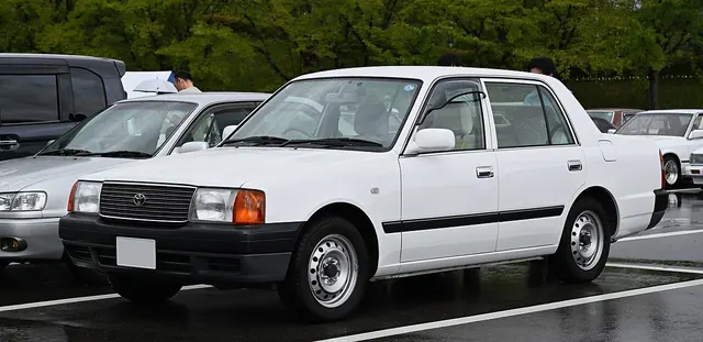 A white training car parked outdoors.