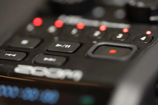 A close view of illuminated controls on a portable audio recorder.