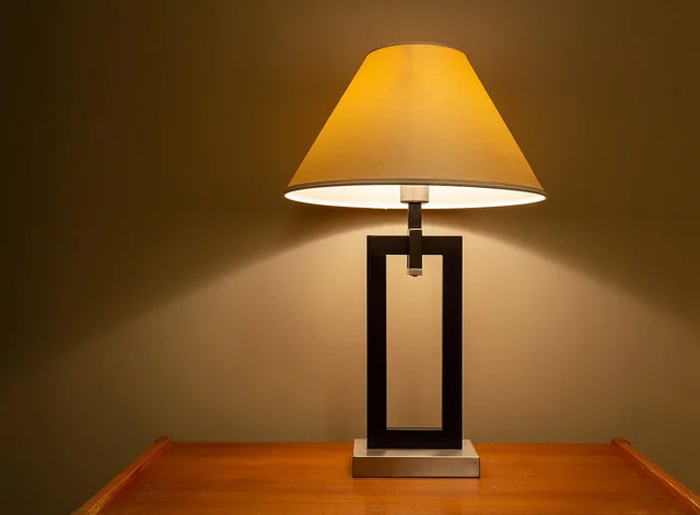 A table lamp casting a warm light.
