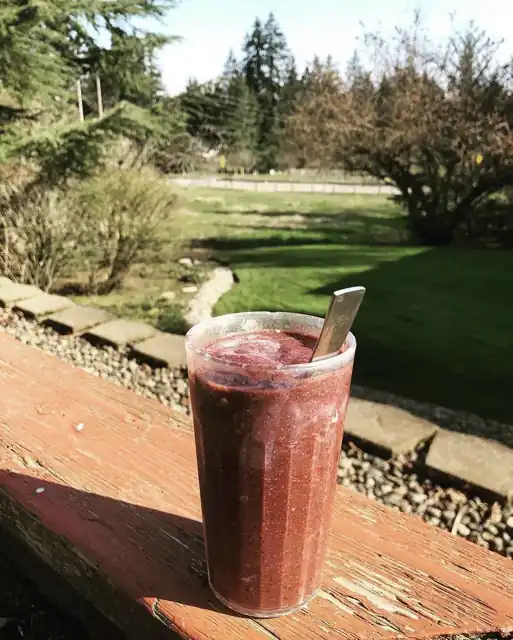 A berry smoothie in a glass.