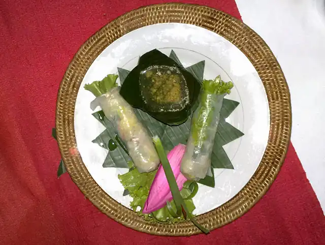 Fresh spring rolls served with a dipping sauce.