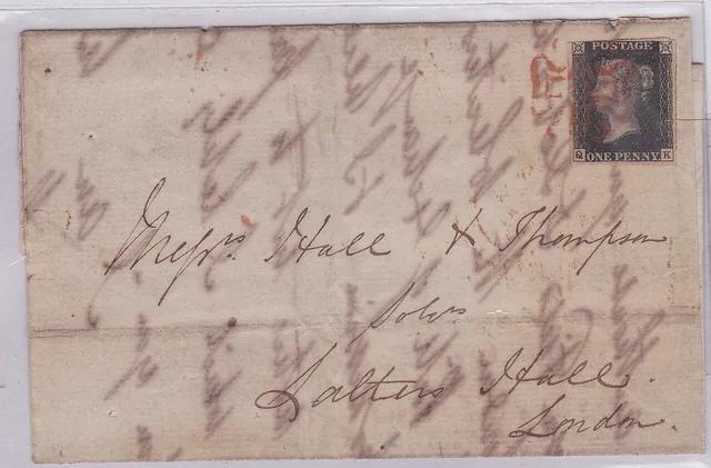 An antique postal card bearing a Penny Black stamp and handwritten address.