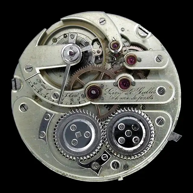 The exposed mechanical movement of a pocket watch.
