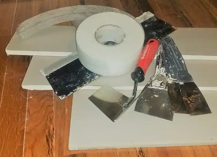 Jointing tape, filling tools and drywall materials.