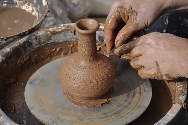 Clay being shaped on a pottery wheel.