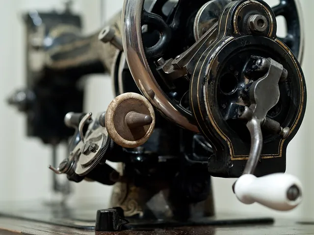 A close view of the mechanism of a vintage sewing machine.