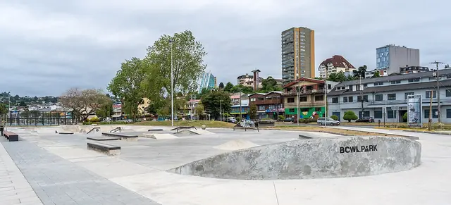 Concrete ramps and bowls at a skatepark.
