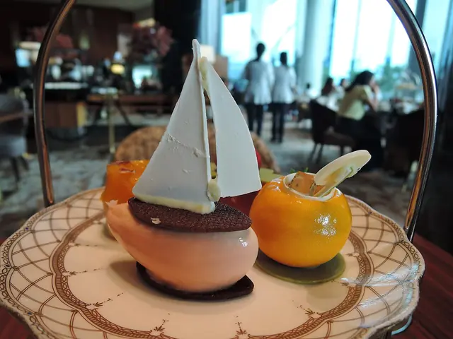 Small desserts arranged on a plate at afternoon tea.