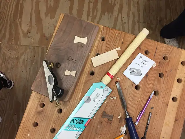 Hand tools laid out for woodwork.
